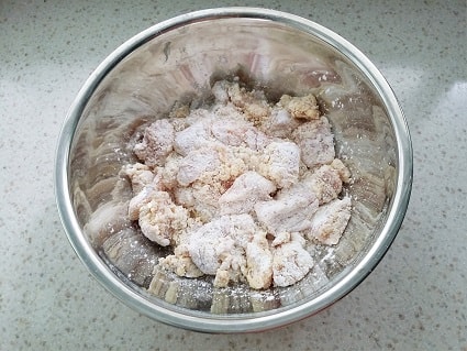 raw chicken covered in flour