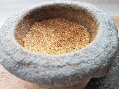pounding spices with mortar and pestle